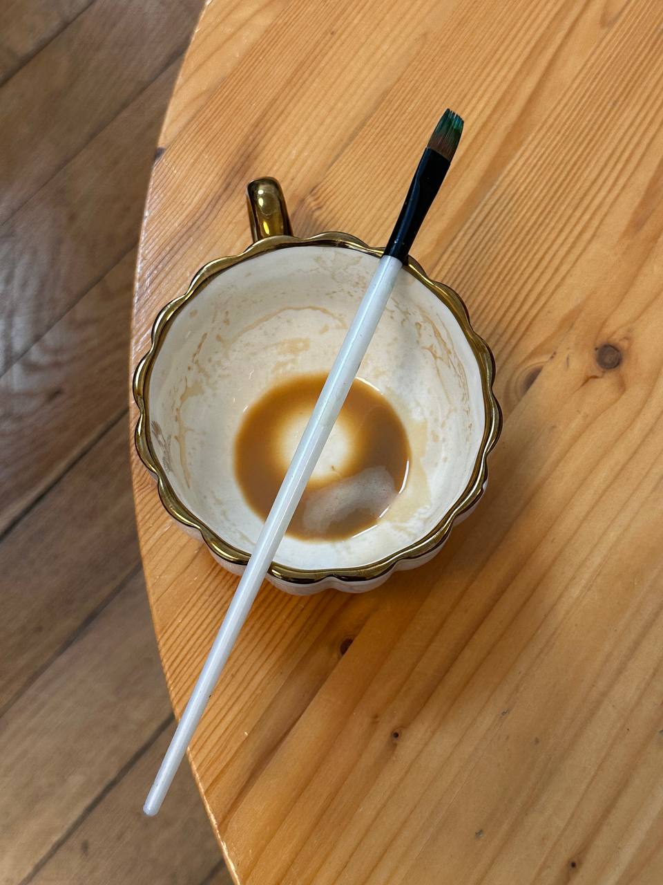 A window, a coffee and a small travel notebook