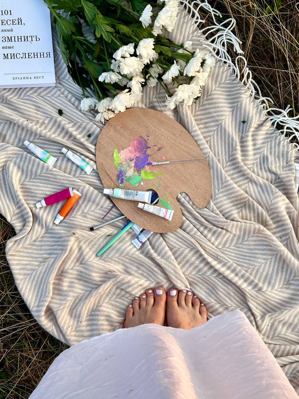 Paints and an open sketchbook